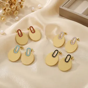 Detailed macro view of minimalist stainless steel round disk earrings in four enamel colors