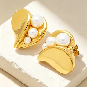 Elegant gold heart earrings with asymmetric pearl inlay design, French style detail