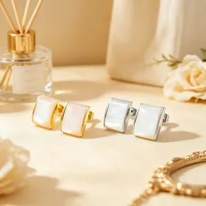 Close-up detail of stainless steel quadrilateral earrings with mother of pearl inlay