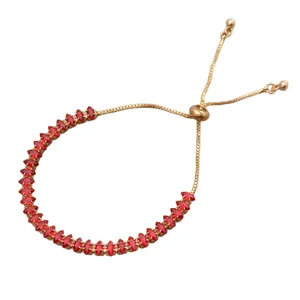Elegante bracciale dorato con zirconi rossi taglio marquise e chiusura regolabile