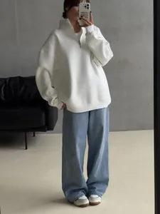 Oversize fleece lined sweatshirt with half-zip collar and loose drop shoulder design