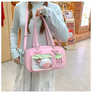 Sac à main japonais rose avec fenêtre transparente et décorations de poupées en peluche