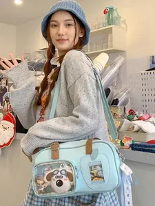Sac Ita bleu clair avec fenêtre transparente et accessoires en peluche