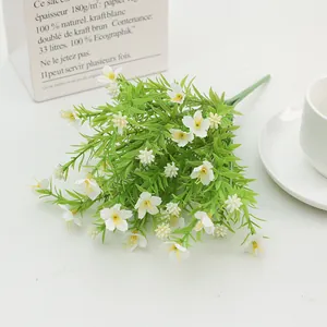 Detail of faux jasmine bouquet in white paper bag for natural home floral decoration