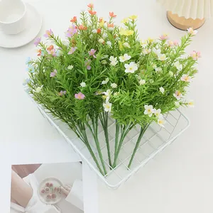Artificial jasmine and daisy bouquet in white basket for home decor and floral styling