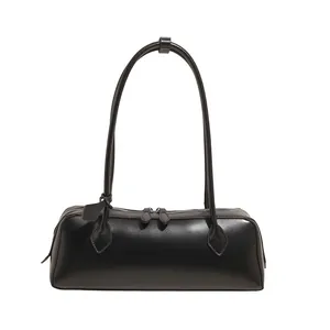 Minimalist black oblong baguette handbag with silver hardware for shoulder and hand carry