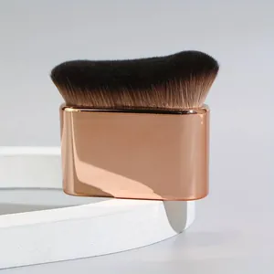 Professional flat body tanning brush with rose gold handle and soft dense bristles