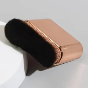Professional body tanning brush with soft dark bristles and rose gold metallic handle