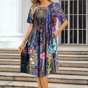 Detail view of colorful artistic print on round neck short sleeve knee-length dress