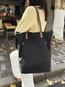 Stylish large capacity black canvas tote bag for women ideal for daily commuting