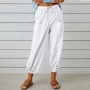 High-waist white cotton linen wide-leg cropped pants with side pockets and buttons