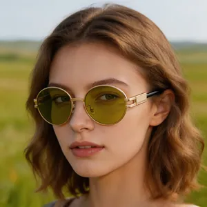 Detailed view of fashionable women's oval sunglasses with yellow lenses and gold frames
