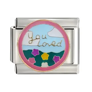 Close-up of stainless steel Italian modular charm link with 'you loved' enamel design.
