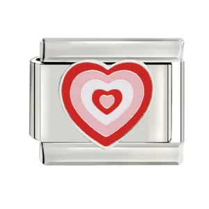 Detailed close-up of a stainless steel Italian charm featuring nested red pink hearts