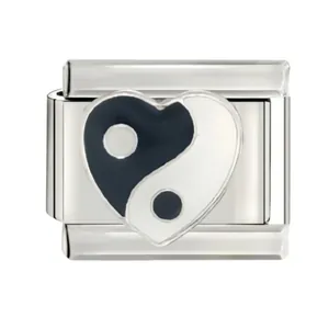 Detailed view of a stainless steel Italian modular charm with a heart yin-yang motif.