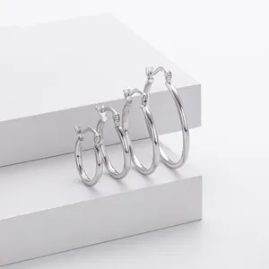 Detailed view of polished S925 sterling silver hoop earrings in four different sizes