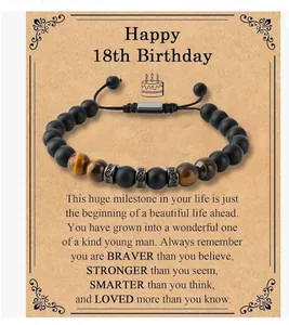Close-up of tiger eye bead bracelet displayed on 18th birthday celebration message card