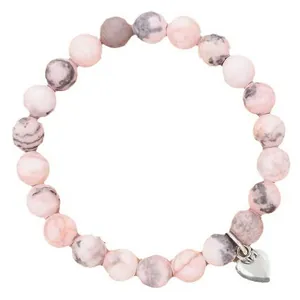 Handmade pink zebra stone beaded bracelet featuring a silver heart charm on white