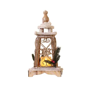 Rustic wooden Christmas lantern with glowing LED candle and artificial snow decoration