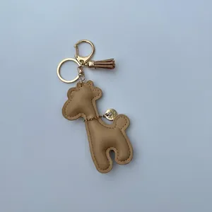 Detailed view of the cute khaki leather giraffe keychain charm with dimensions shown.