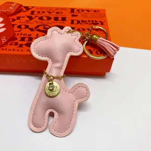 Cute pink giraffe PU leather keychain with tassel and gold charm for bags