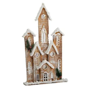 Rustic wooden Christmas house decoration with snow effect for festive holiday displays.