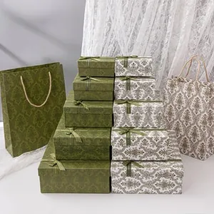 Élégantes boîtes cadeaux bijoux à motif damassé avec nœuds et sacs en papier assortis