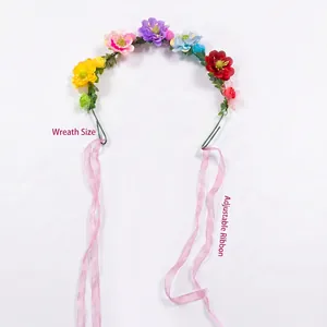 A detailed view showing the colorful bohemian floral headband with adjustable pink ribbons