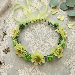 Elegant Bohemian floral headband with light green flowers and ribbon for seaside wedding