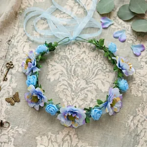 Detailed macro view of a bohemian floral crown with blue and purple silk flowers