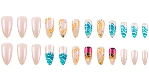 Detailed view of almond shaped press-on nails with summer ocean and orange slice patterns
