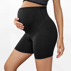 Close-up detail of high-waist black maternity biker shorts providing belly support