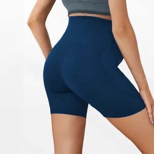 Detail view of high-waisted navy blue maternity yoga shorts for pregnancy support