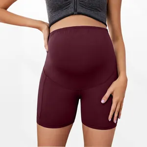 Detailed view showing the high-waisted belly support design of these maternity shorts