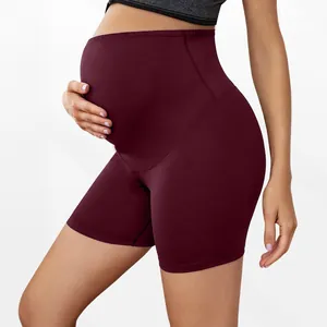 High-waisted supportive maternity shorts in burgundy for active pregnancy yoga