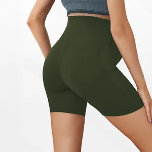Close-up detail of high-waist maternity workout yoga shorts in army green showing back fit.