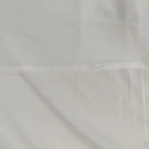 Close-up macro detail showing the smooth silver fabric texture and fine stitching