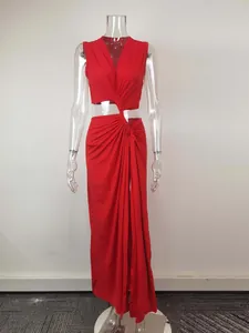 Detail of a sexy red knotted hollow-out dress with high-slit and midriff-baring design