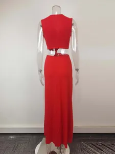 Back view of a red sexy cutout maxi dress featuring twisted waist detail on mannequin