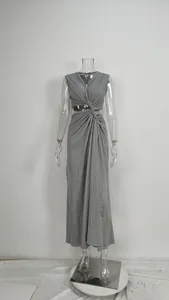 Close-up of a gray sexy knot cutout waist maxi dress displayed on a clear mannequin