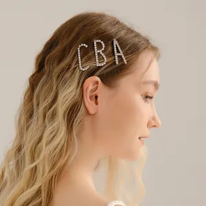 Elegant minimalist set of three rhinestone letter hairpins A B C worn as side hair clips
