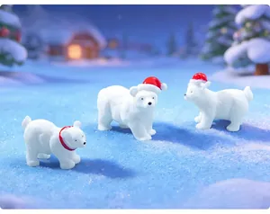 Close-up of three cute polar bear figurines with Christmas hats in a snowy scene