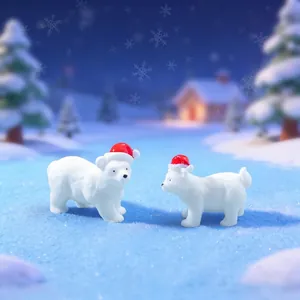 Adorable polar bear figurines with red Santa hats for festive Christmas micro landscape