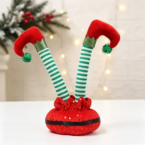 Detailed view of bendable striped Christmas elf legs decoration on a white table