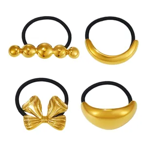 Set of four 18K gold plated stainless steel hair ties with bold metallic designs