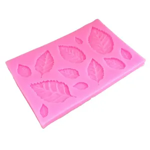 Pink silicone mold featuring various leaf and maple leaf shapes for DIY cake fondant