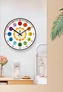 Detailed view of a colorful educational wall clock in a modern bedroom setting