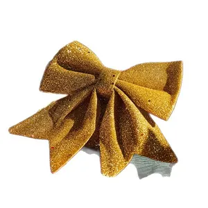 Elegant large golden glitter Christmas bow ornament for festive tree and wreath decoration