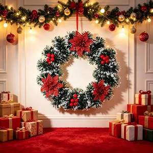 Artificial Christmas wreath with red poinsettias and berries for festive home decoration