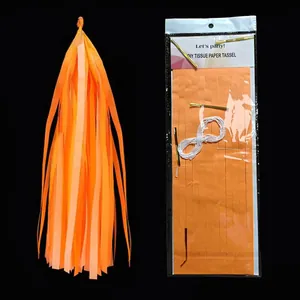 Orange DIY tissue paper tassel kit with packaging for party decorations